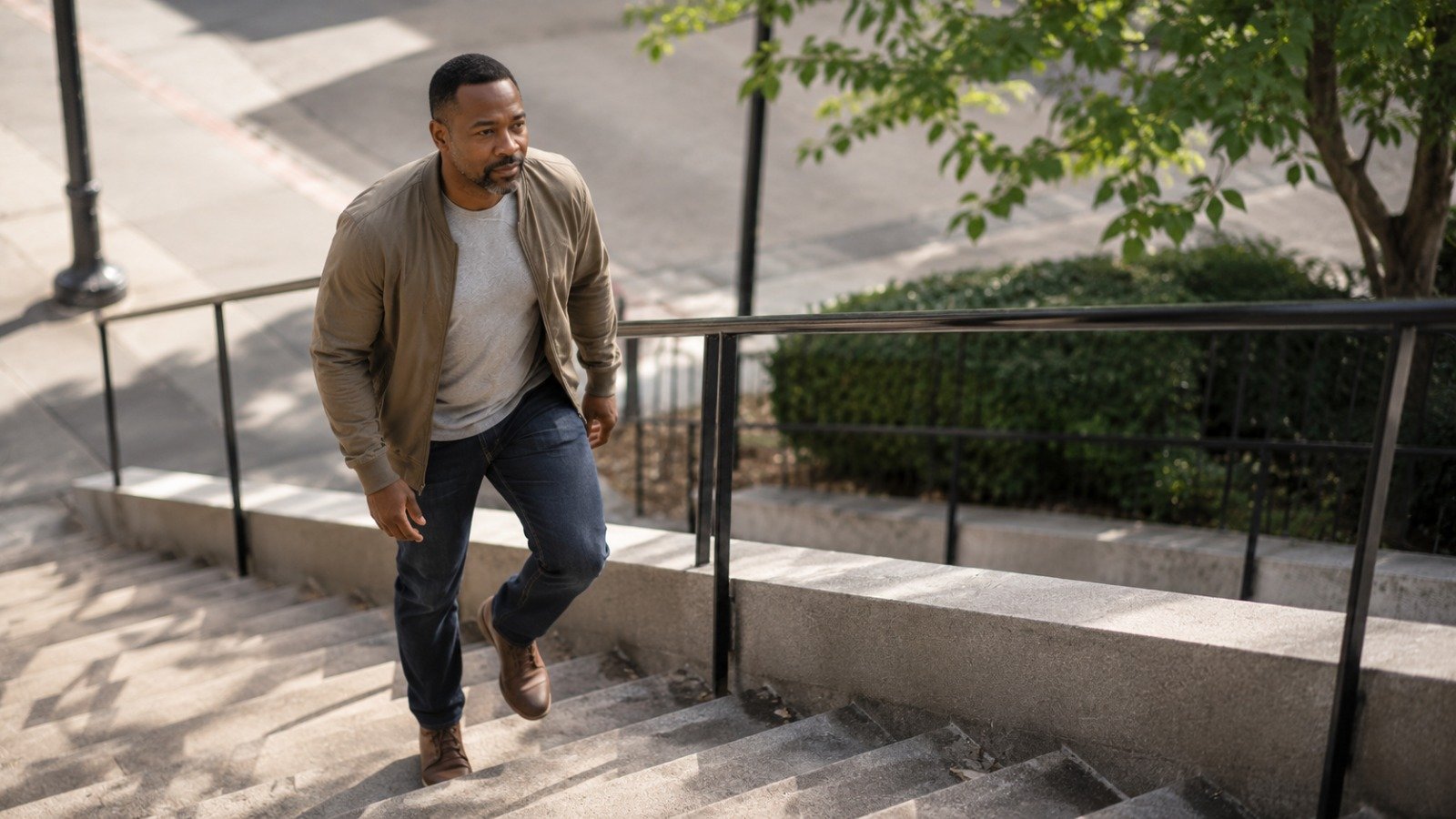 A man adding movement to his day by taking outdoor stairs